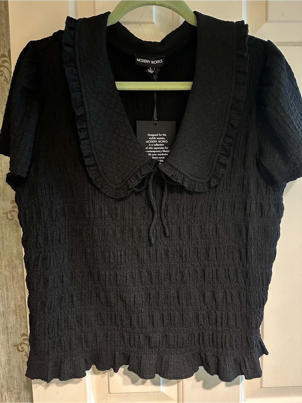 NWT, black pucker material, feminine collar, ss top